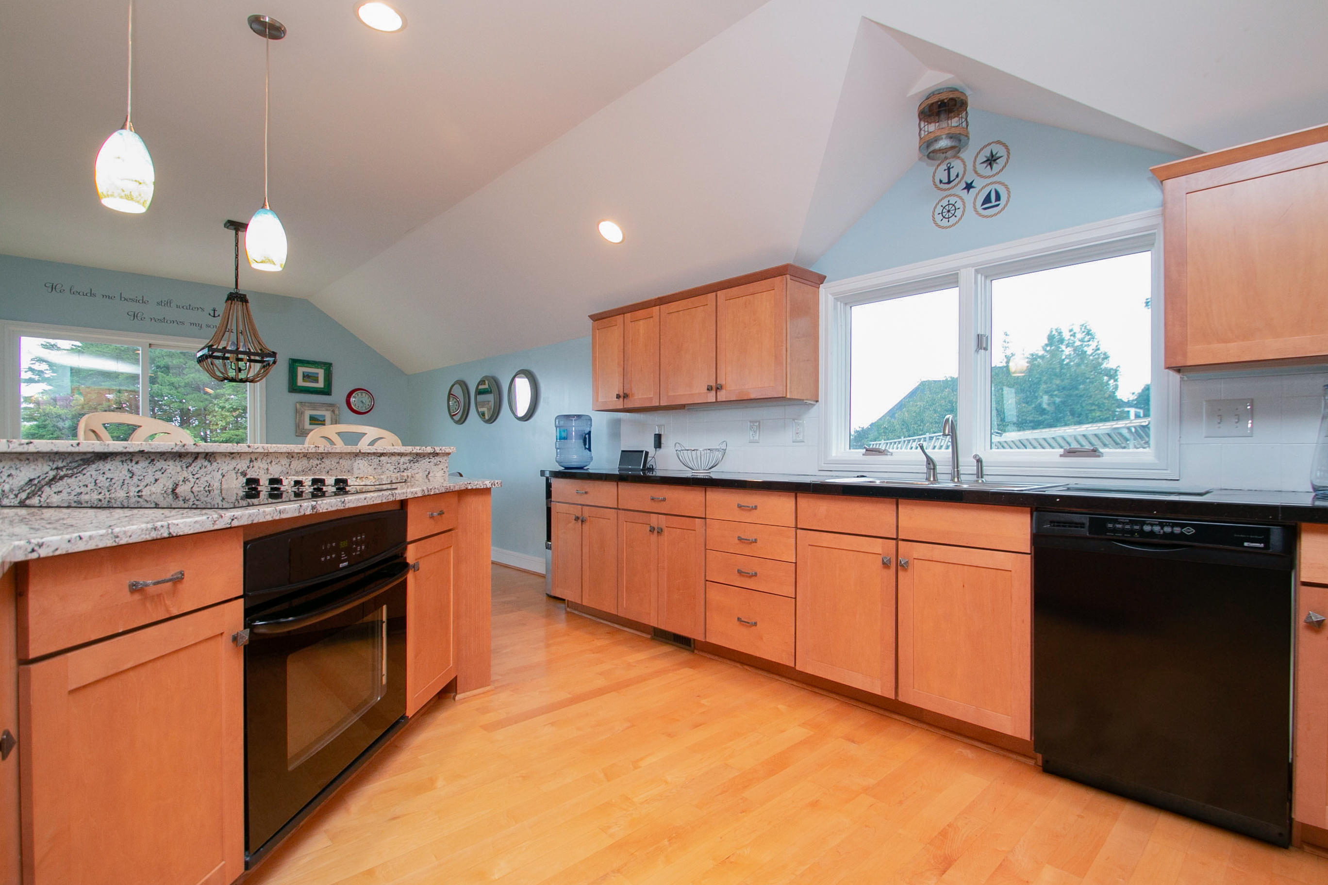 41 Fantasy Point Circle Union Hall, VA 24176 - Photo 17 of 67 a kitchen with stainless steel appliances kitchen island granite countertop a stove a sink and a wooden cabinets