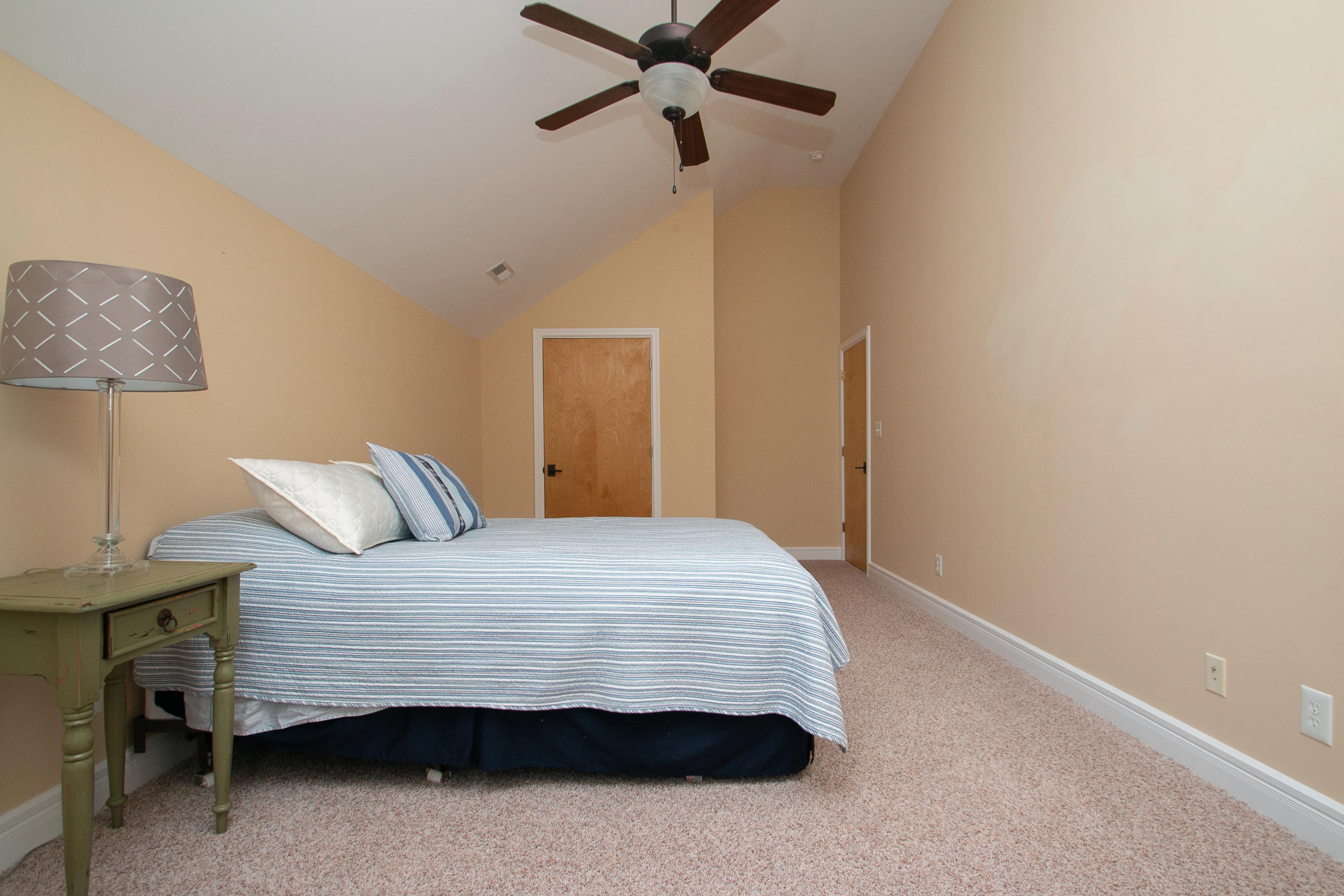 41 Fantasy Point Circle Union Hall, VA 24176 - Photo 41 of 67 a bedroom with a bed and a chandelier