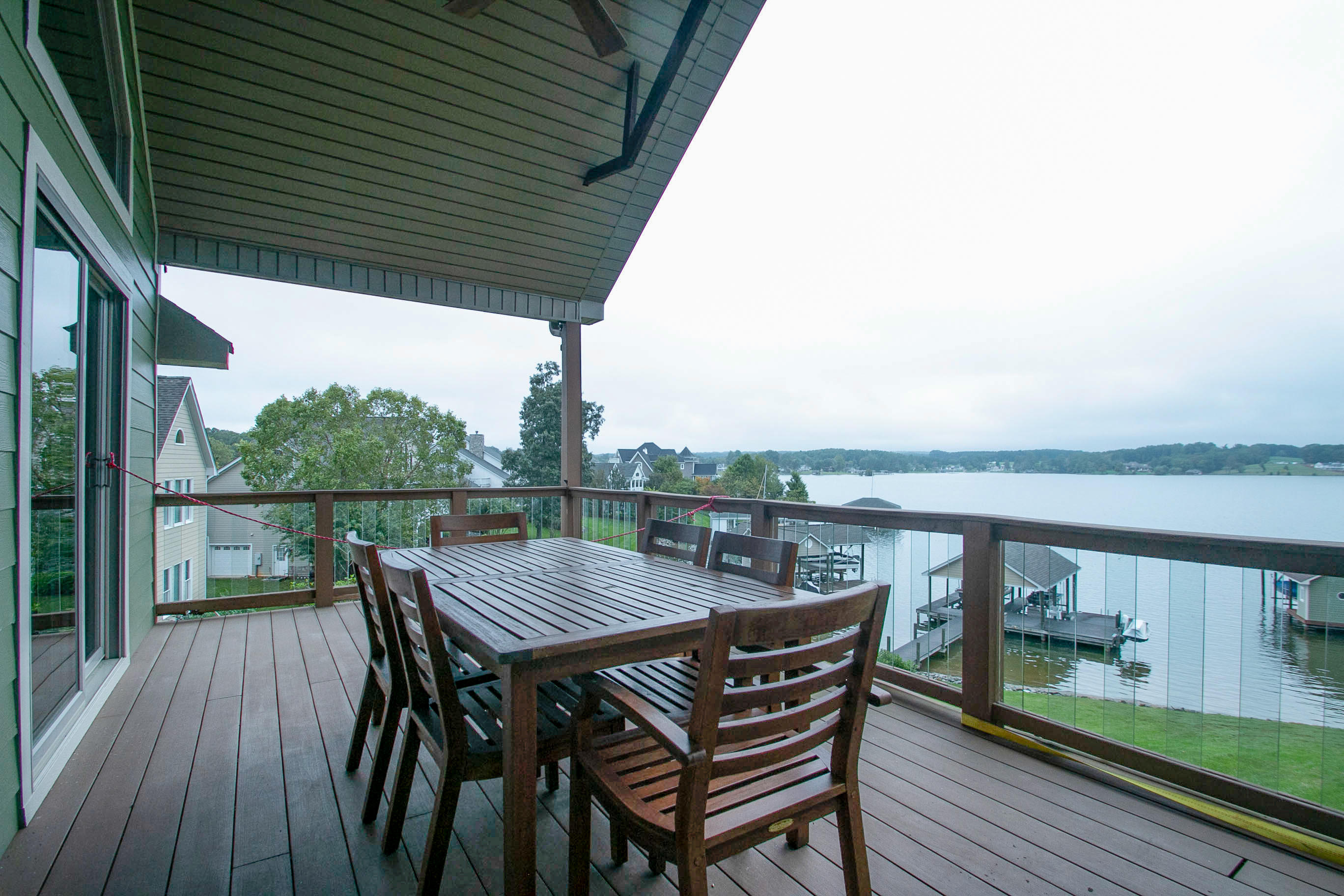 41 Fantasy Point Circle Union Hall, VA 24176 - Photo 47 of 67 a view of a balcony with table and chairs and wooden floor