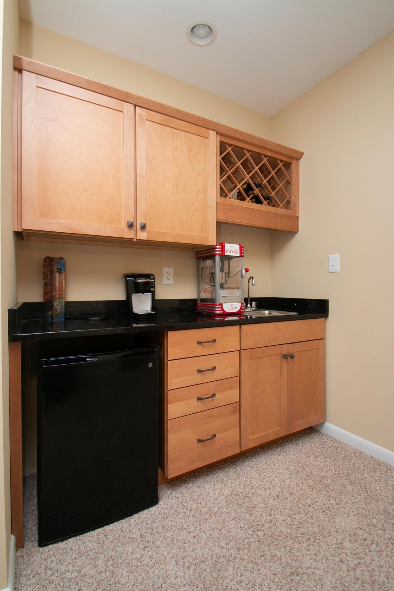 41 Fantasy Point Circle Union Hall, VA 24176 - Photo 54 of 67 a kitchen with granite countertop white cabinets and black appliances