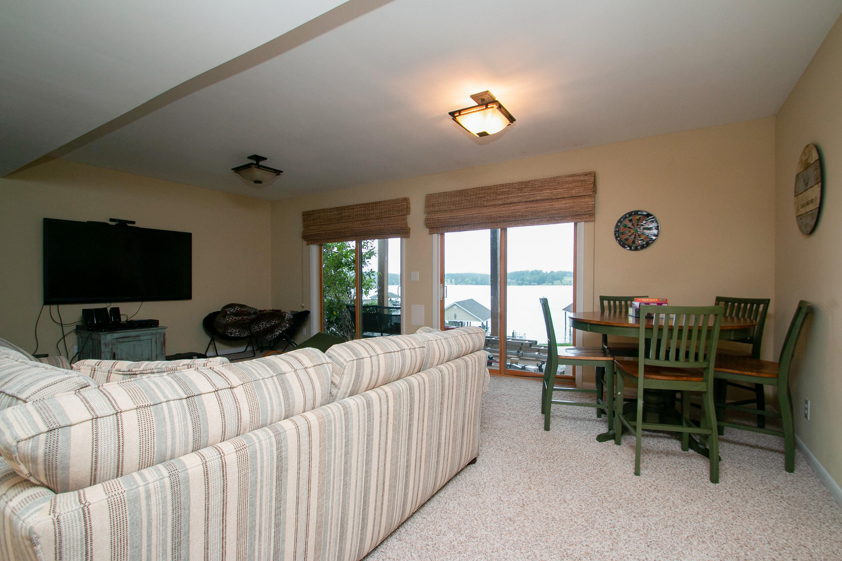 41 Fantasy Point Circle Union Hall, VA 24176 - Photo 56 of 67 a living room with furniture a flat screen tv and a large window