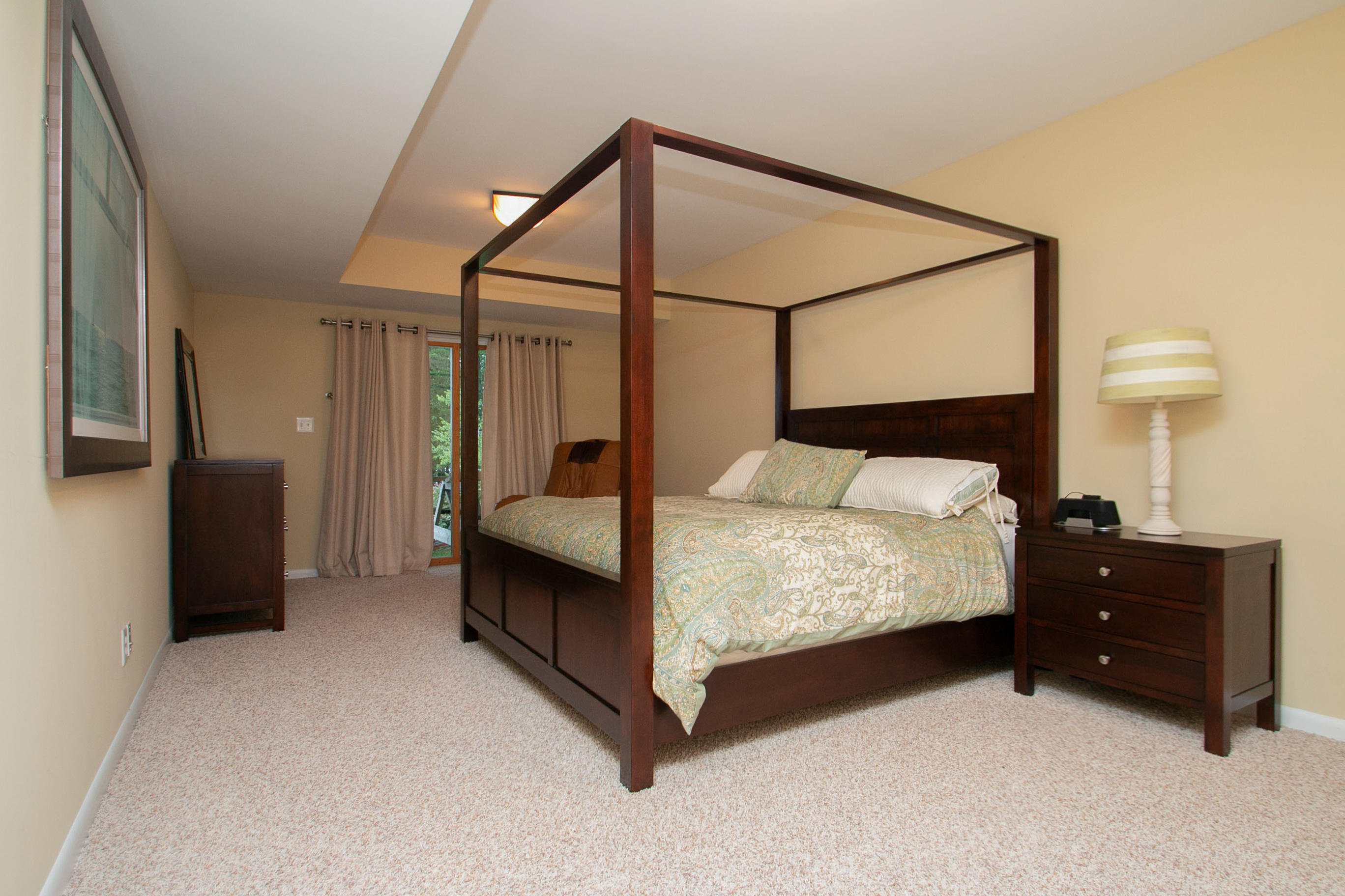 41 Fantasy Point Circle Union Hall, VA 24176 - Photo 60 of 67 a bedroom with a bed and lamp on table