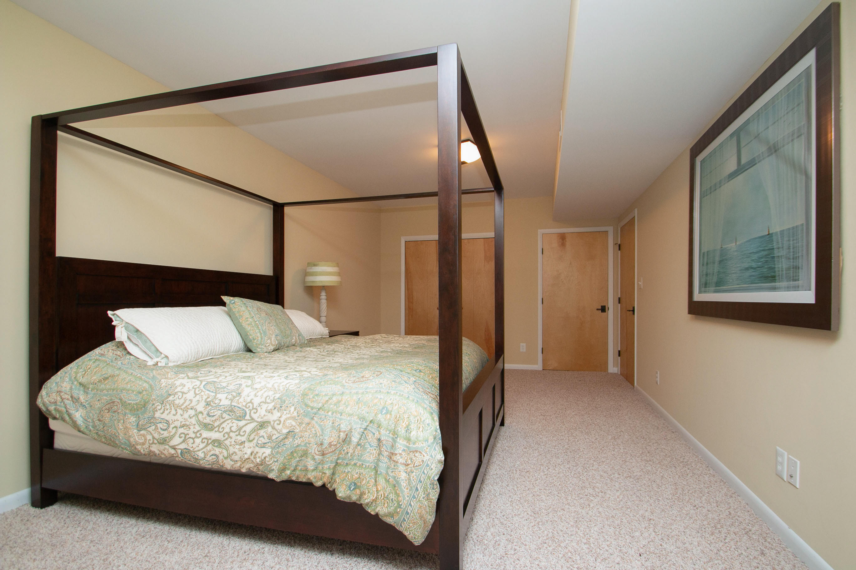 41 Fantasy Point Circle Union Hall, VA 24176 - Photo 61 of 67 a bedroom with a large bed and a mirror