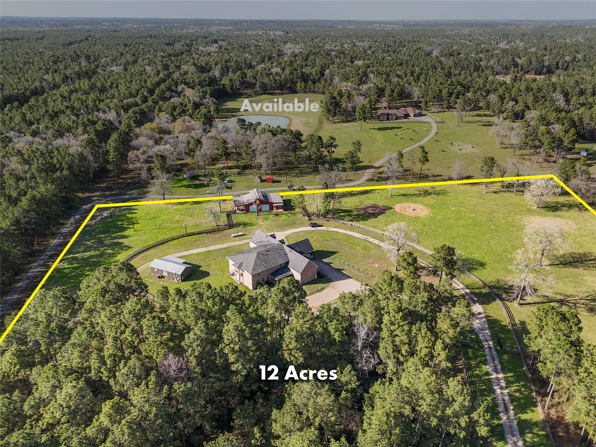 an aerial view of a house with a swimming pool