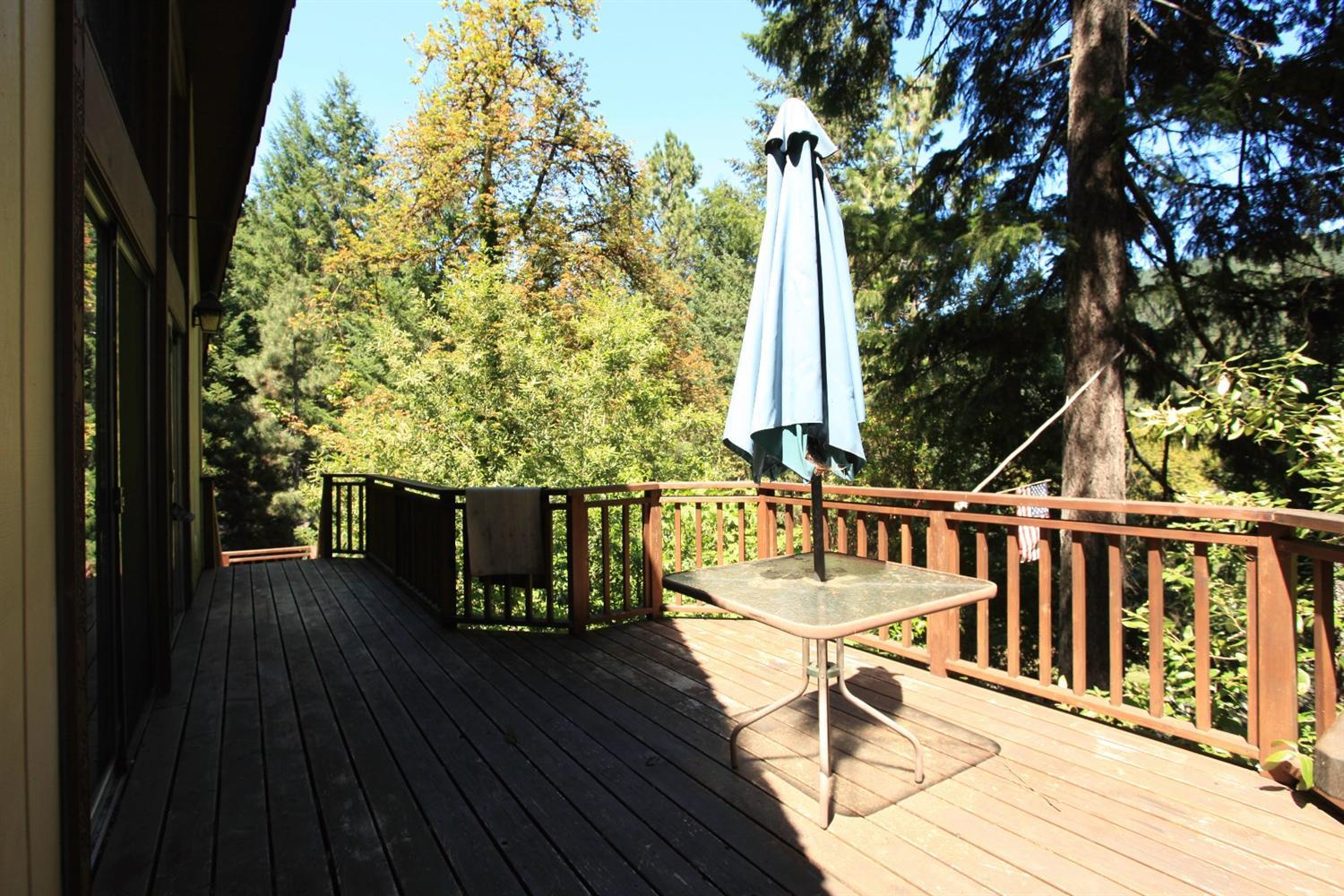 12093 Galice Road Merlin, OR 97532 - Photo 6 of 26 a view of a balcony with chairs