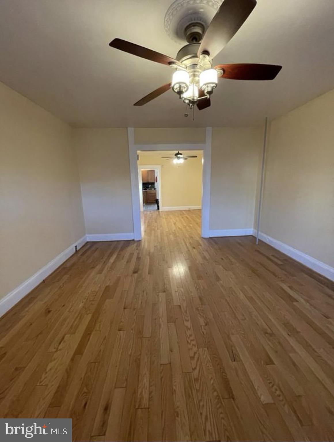 1340 Butler Street Easton, PA 18042 - Photo 4 of 10 a view of a livingroom with a chandelier fan and wooden floor