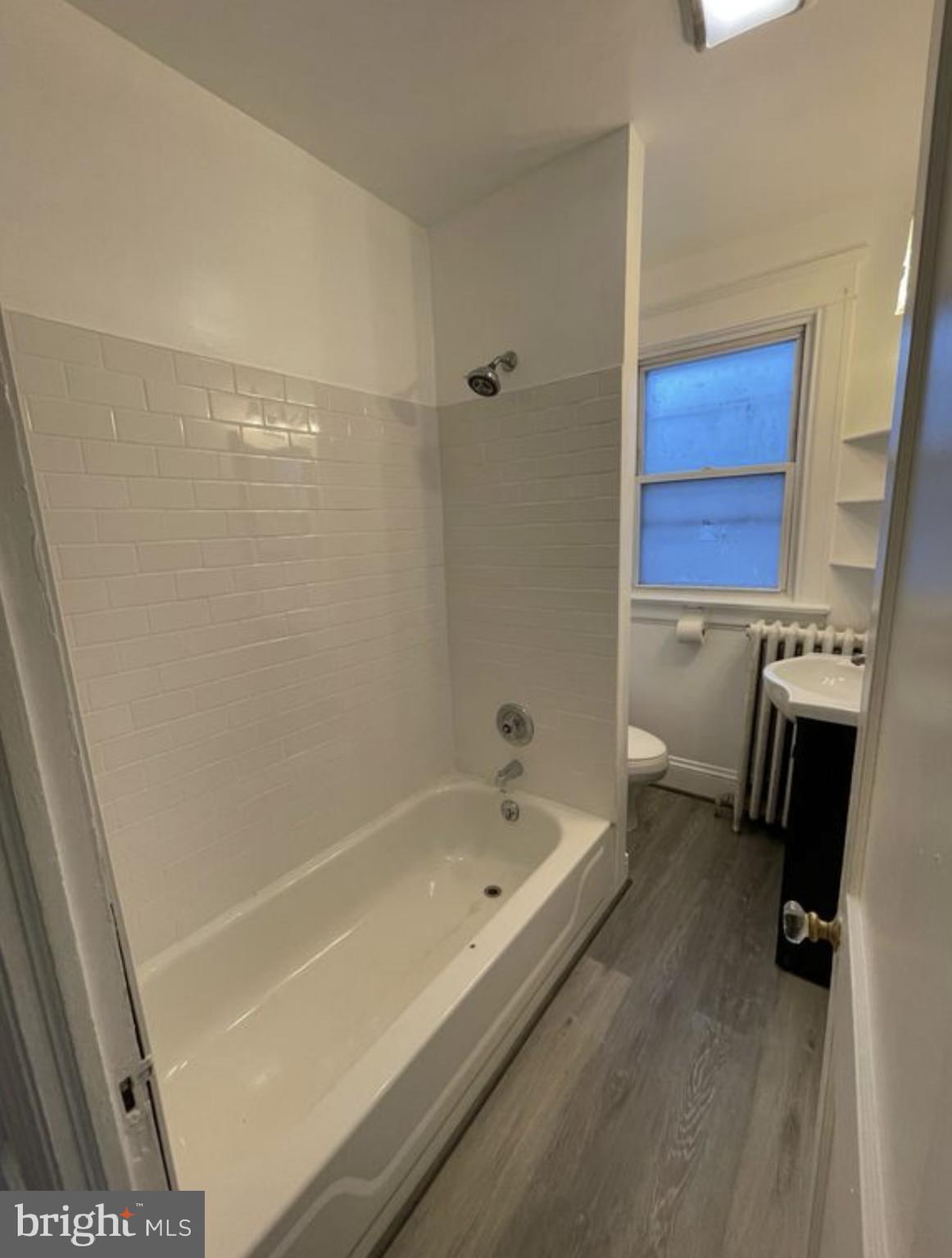 1340 Butler Street Easton, PA 18042 - Photo 7 of 10 a bathroom with a bathtub and a shower