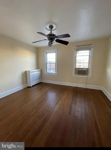a view of room window and wooden floor