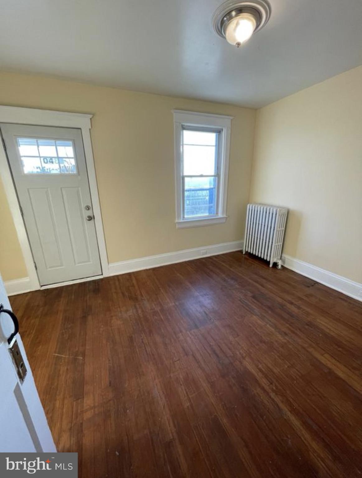 1340 Butler Street Easton, PA 18042 - Photo 9 of 10 a view of an empty room with wooden floor and a window