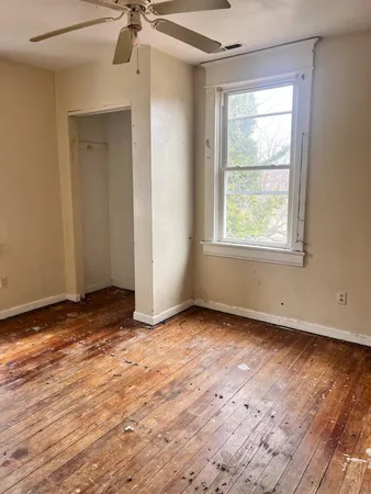 a kitchen with a stove top oven and cabinets