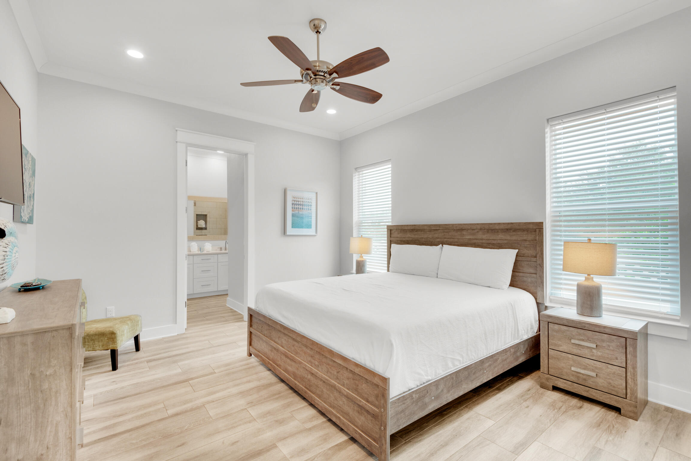 55 St Simon Circle Miramar Beach, FL 32550 - Photo 16 of 45 a bedroom with a large bed and a chandelier