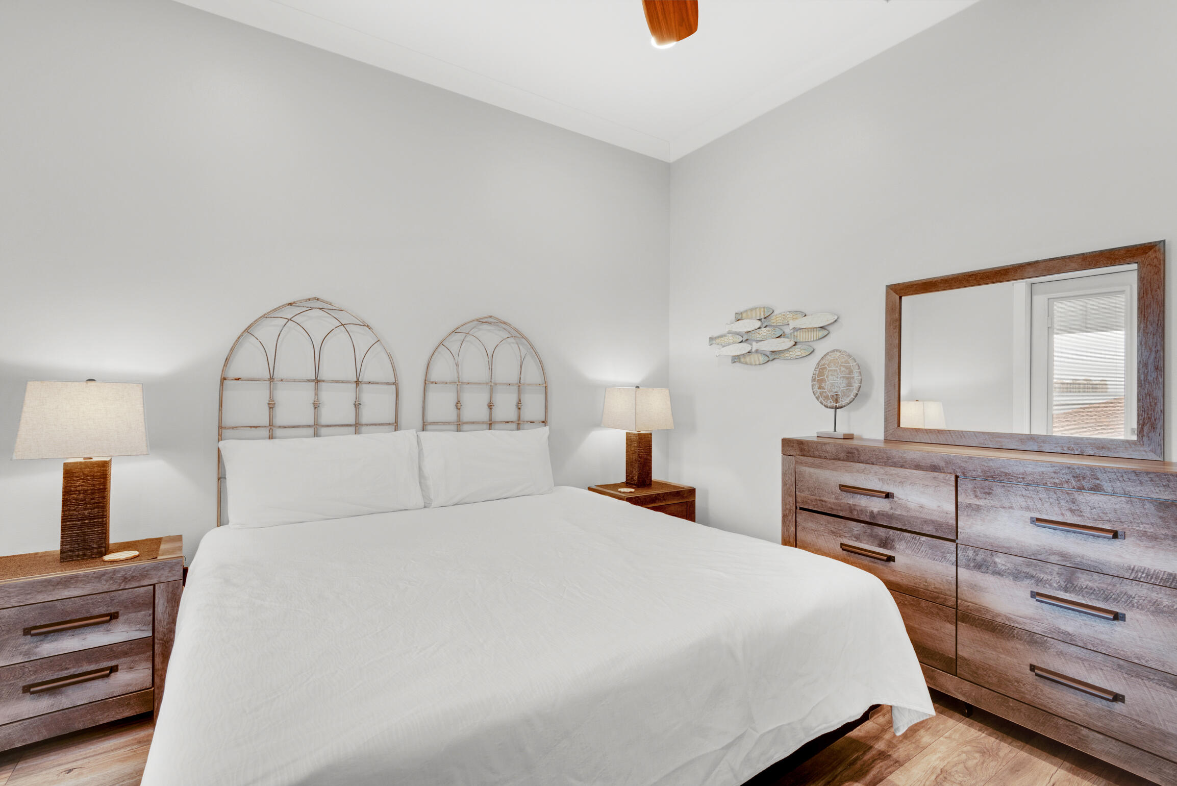 55 St Simon Circle Miramar Beach, FL 32550 - Photo 23 of 45 a bedroom with a bed and a dresser