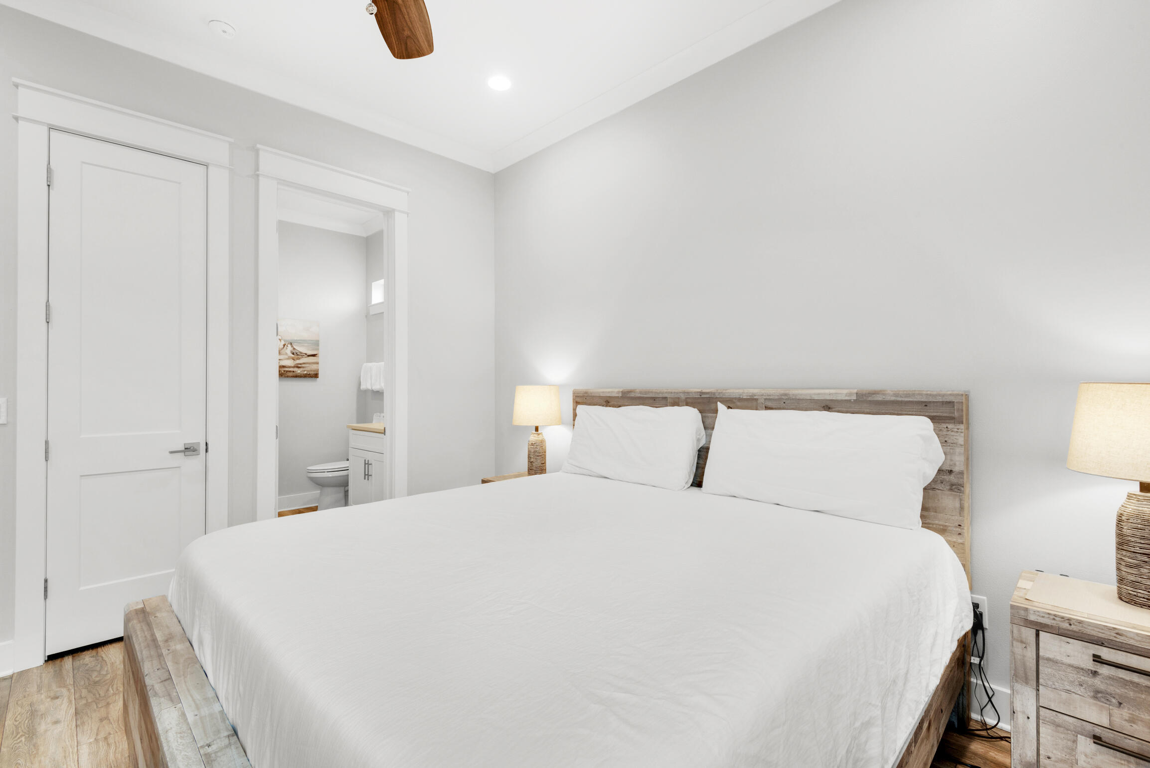 55 St Simon Circle Miramar Beach, FL 32550 - Photo 30 of 45 a large bed sitting in a bedroom and a table