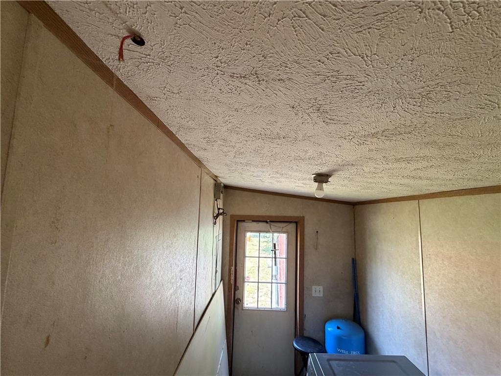 4541 Main Street Slatington, PA 18080 - Photo 26 of 27 A utilitarian space featuring functional lighting and a simple exterior door leading to the outside.