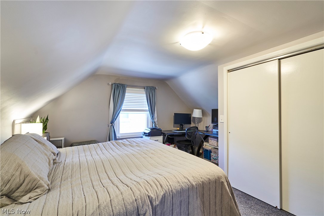28322 Forest Road Willowick, OH 44095 - Photo 24 of 32 2nd Floor Master Bedroom featuring vaulted ceiling, a closet, and carpet floors