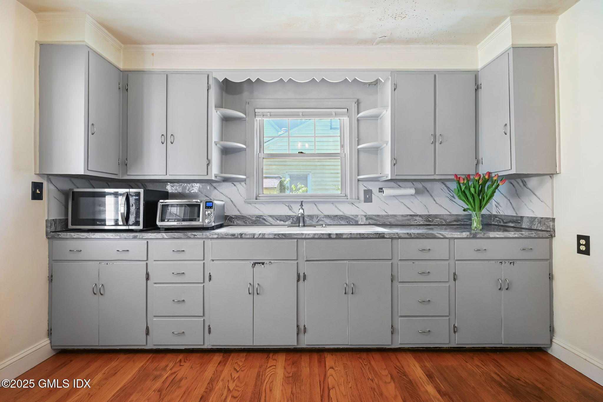 55 Byram Road Greenwich, CT 06830 - Photo 16 of 50 a kitchen with sink cabinets and window