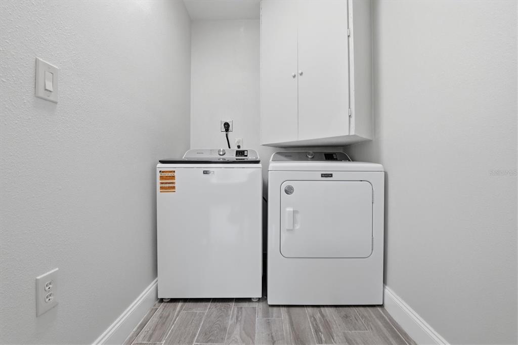 6244 Colony Circle Weeki Wachee, FL 34607 - Photo 56 of 60 a utility room with dryer and washer