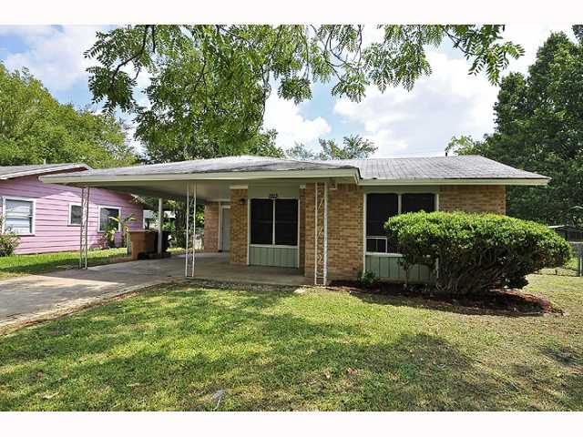 1213 Arthur Stiles Road Austin, TX 78721 - Photo 1 of 1 a view of a house with a yard and sitting area