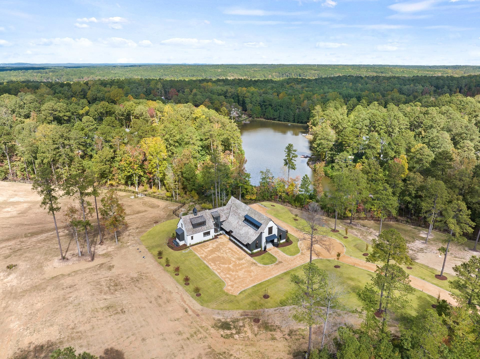 155 Settlement Drive Apex, NC 27523 - Photo 2 of 65 a view of a lake with a yard