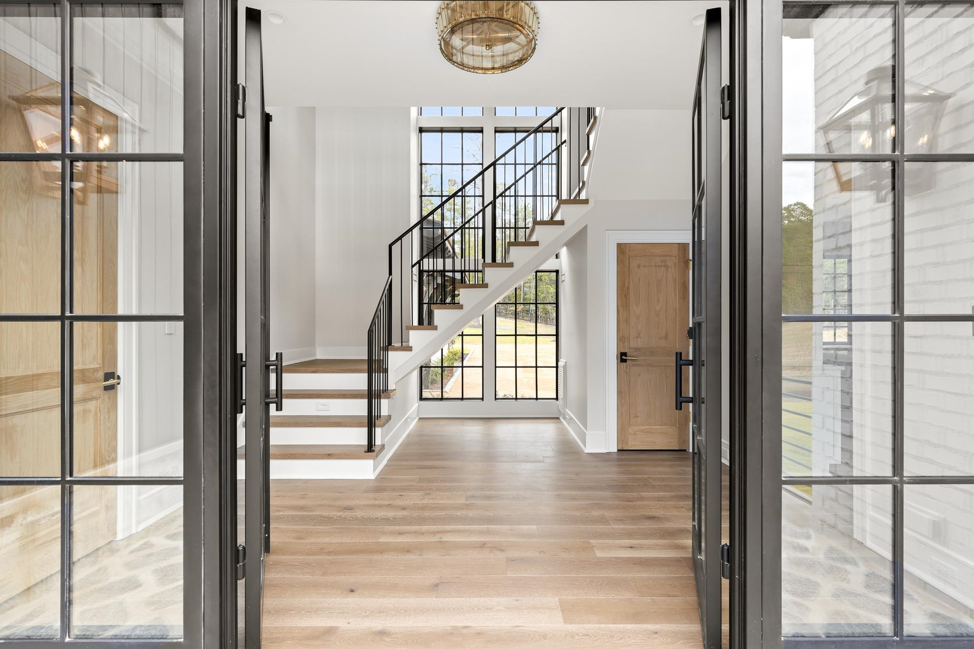 155 Settlement Drive Apex, NC 27523 - Photo 24 of 65 a view of entryway with wooden floor and a door
