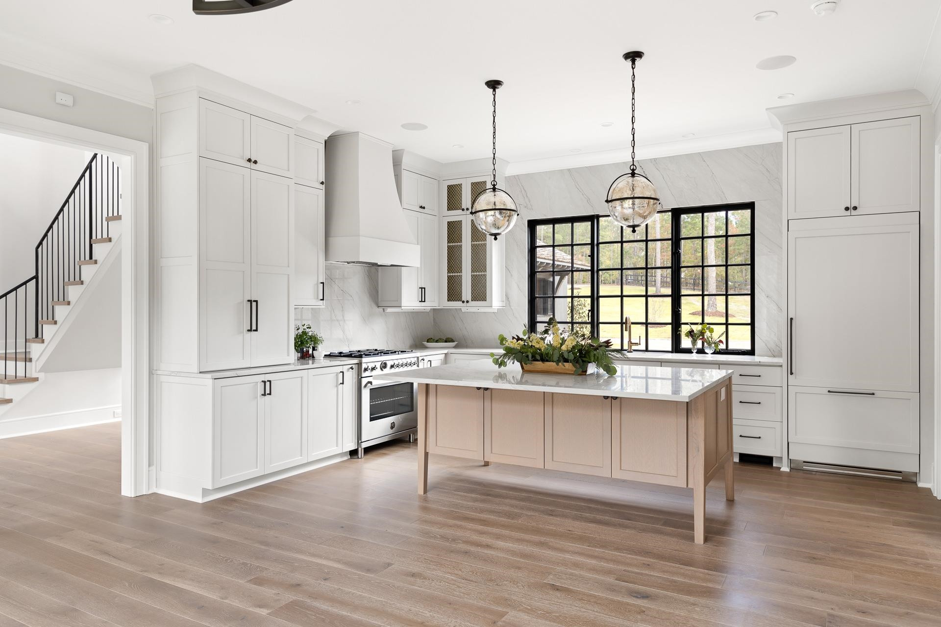 155 Settlement Drive Apex, NC 27523 - Photo 26 of 65 a kitchen with stainless steel appliances granite countertop a stove a sink dishwasher a refrigerator and white cabinets with wooden floor