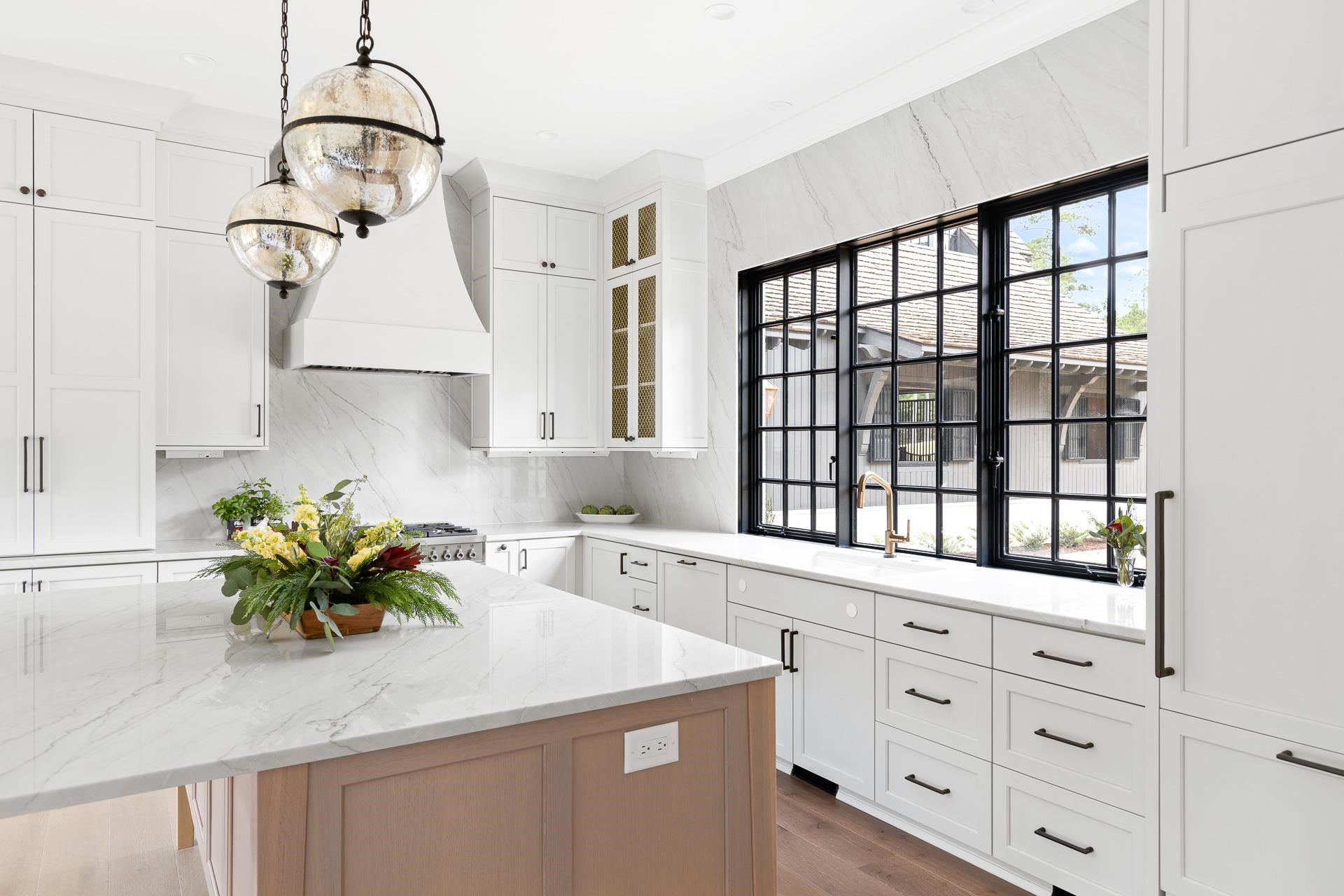 155 Settlement Drive Apex, NC 27523 - Photo 30 of 65 a kitchen with a sink a cabinets and window