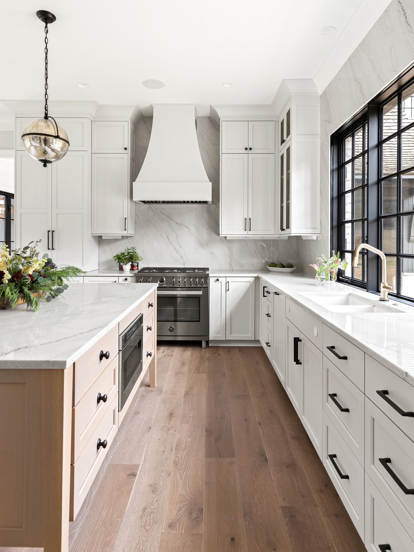 155 Settlement Drive Apex, NC 27523 - Photo 32 of 65 a large white kitchen with stainless steel appliances granite countertop a stove a sink and a refrigerator