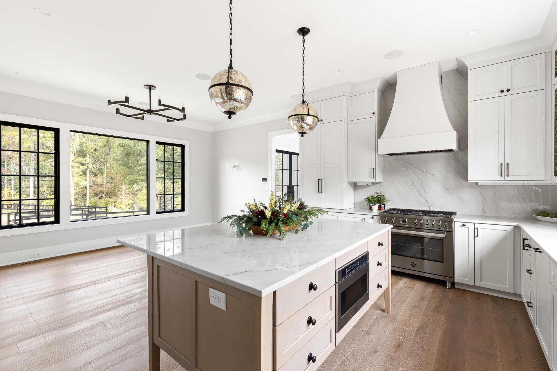 155 Settlement Drive Apex, NC 27523 - Photo 33 of 65 a kitchen with a stove cabinets and wooden floor