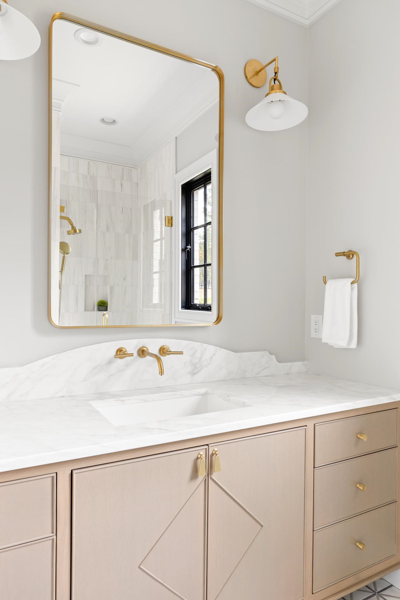 155 Settlement Drive Apex, NC 27523 - Photo 42 of 65 a bathroom with a sink and a mirror