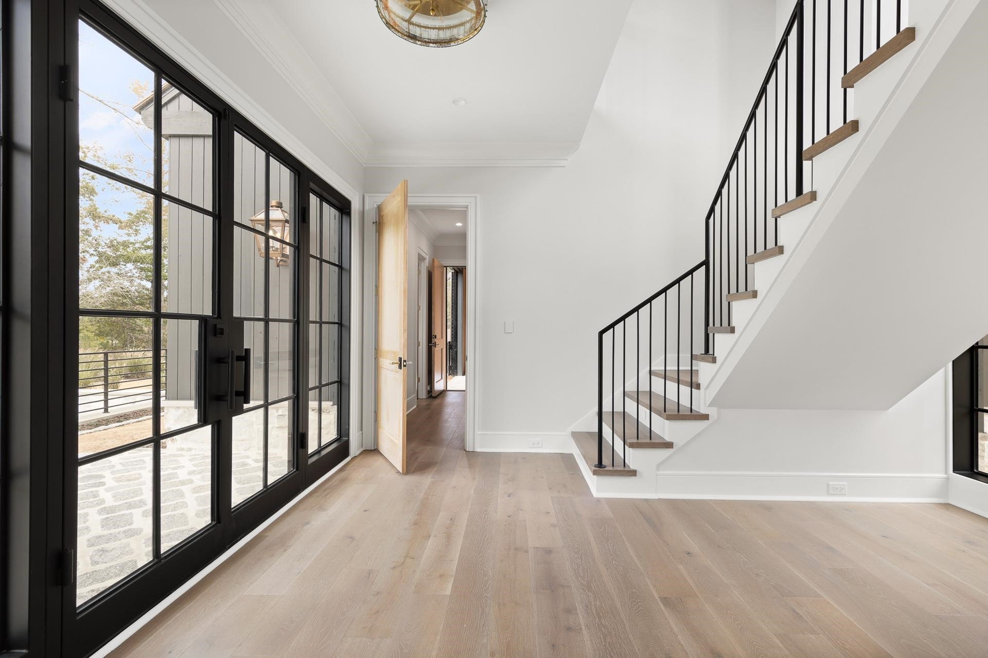 155 Settlement Drive Apex, NC 27523 - Photo 48 of 65 a view of staircase with wooden floor and a window