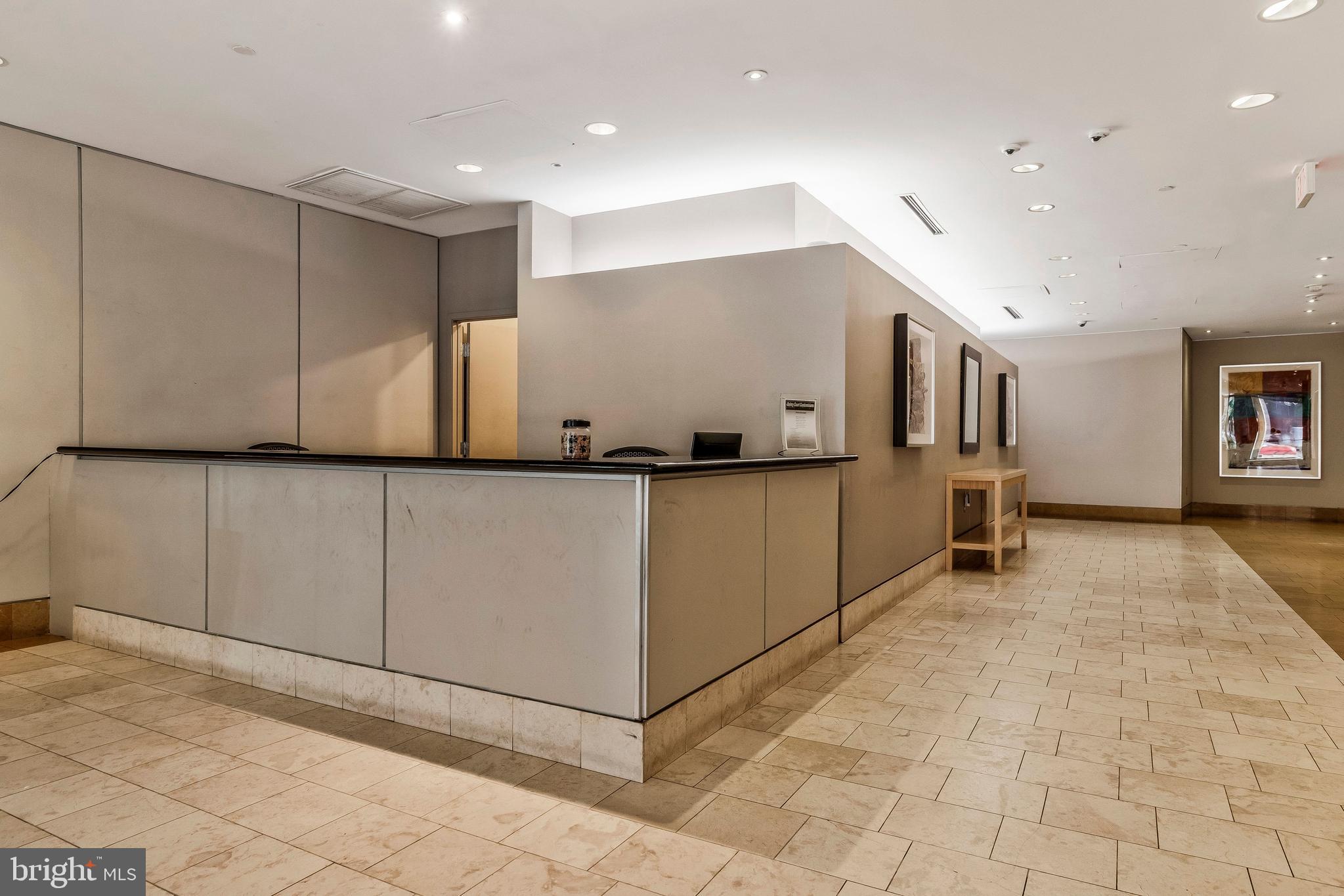 1117 10th Street Northwest, Unit 405 Washington, DC 20001 - Photo 18 of 23 Front desk in lobby