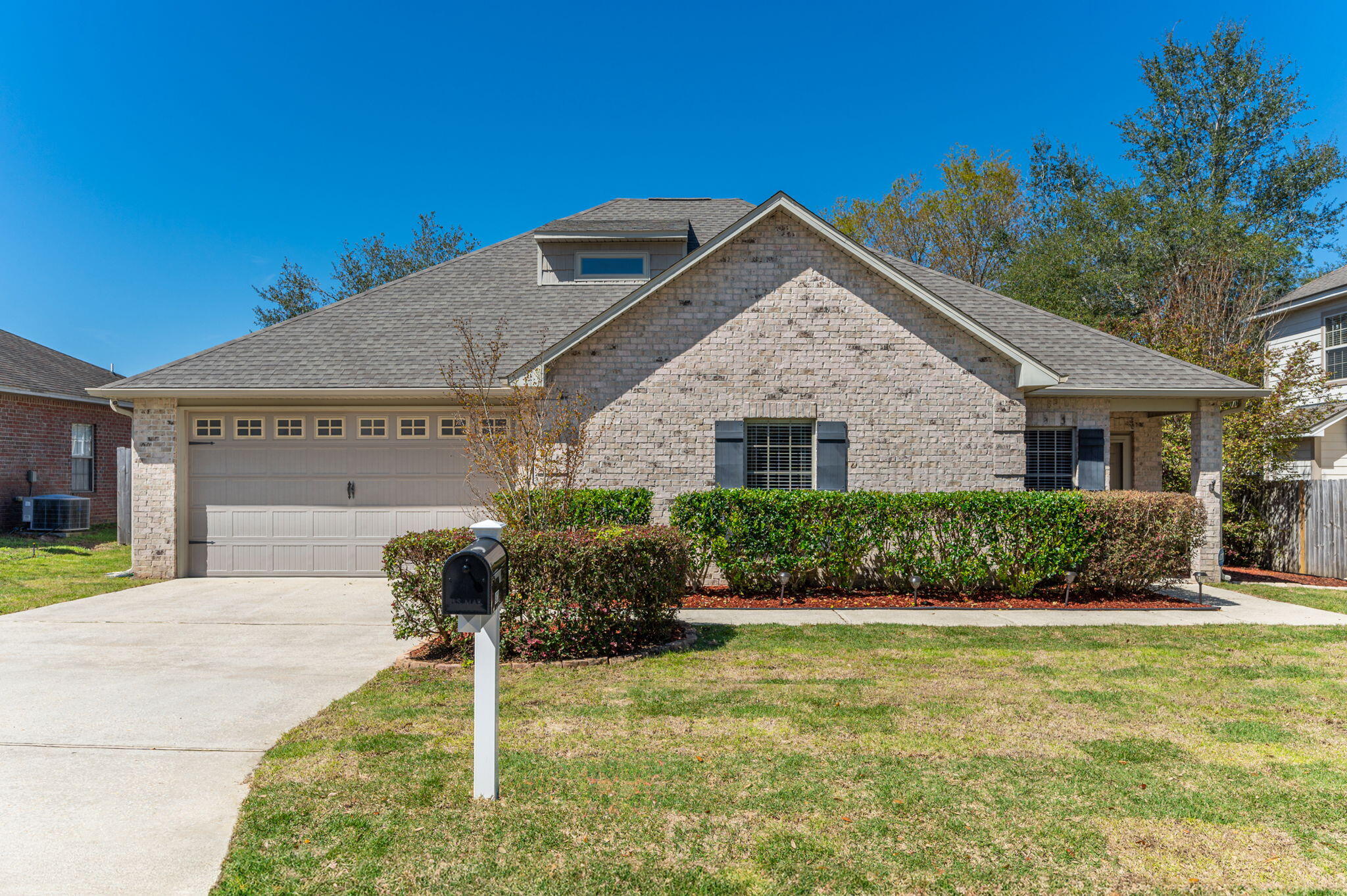 4623 Hermosa Road Crestview, FL 32539 - Photo 1 of 41 a front view of a house with a yard