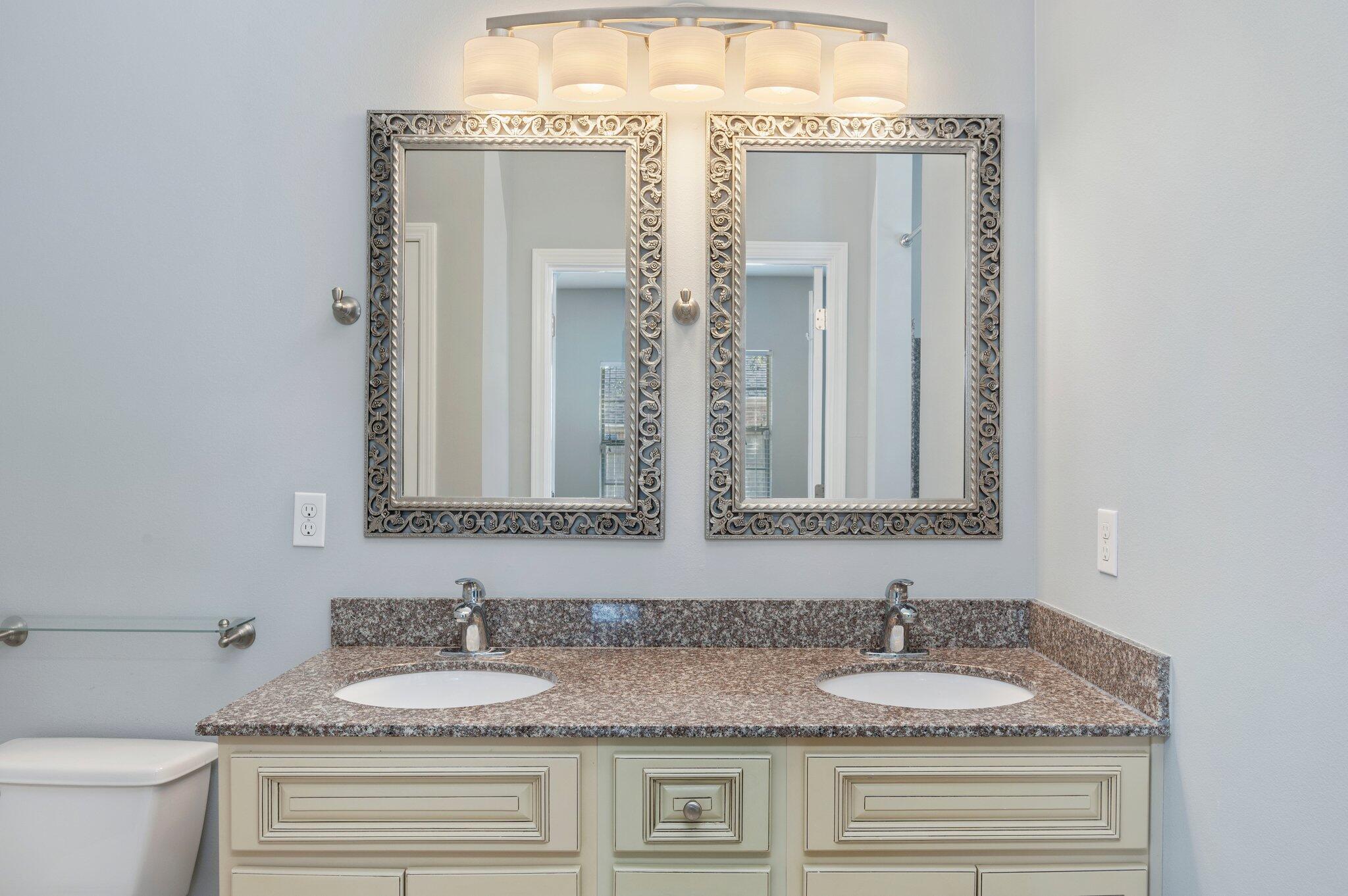 4623 Hermosa Road Crestview, FL 32539 - Photo 20 of 41 a bathroom with a granite countertop sink and a mirror