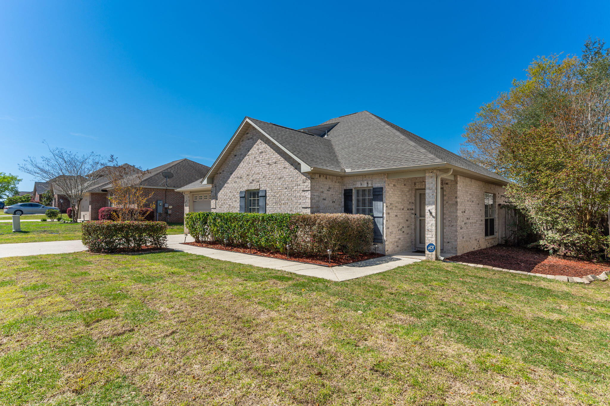 4623 Hermosa Road Crestview, FL 32539 - Photo 2 of 41 a view of a house with a yard and sitting area