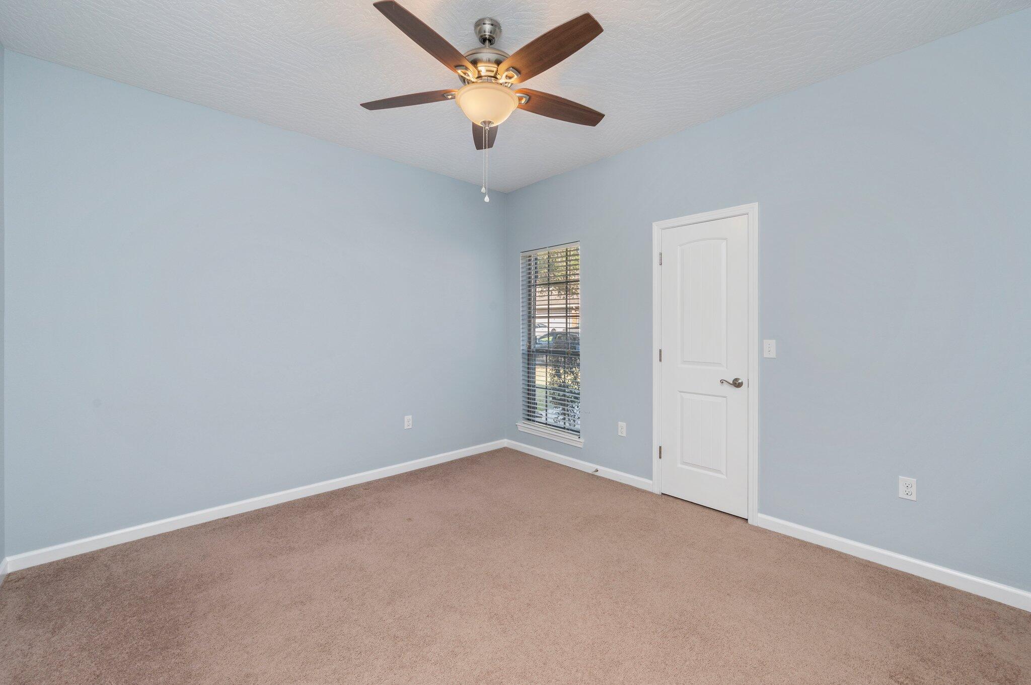 4623 Hermosa Road Crestview, FL 32539 - Photo 24 of 41 an empty room with closet and a chandelier fan
