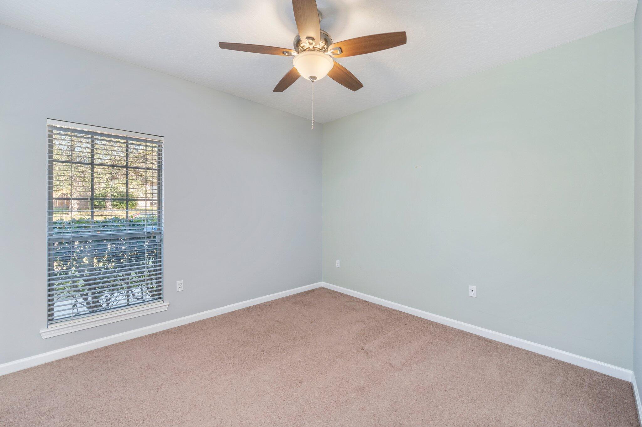 4623 Hermosa Road Crestview, FL 32539 - Photo 26 of 41 an empty room with a window and a fan