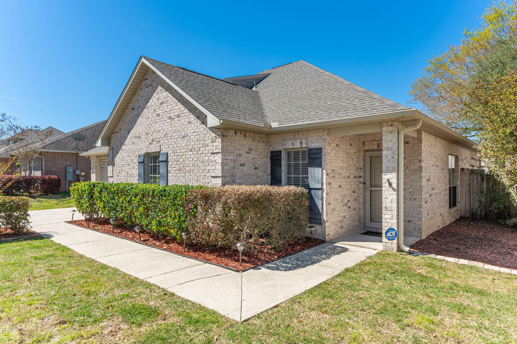 4623 Hermosa Road Crestview, FL 32539 - Photo 3 of 41 a front view of a house with a yard