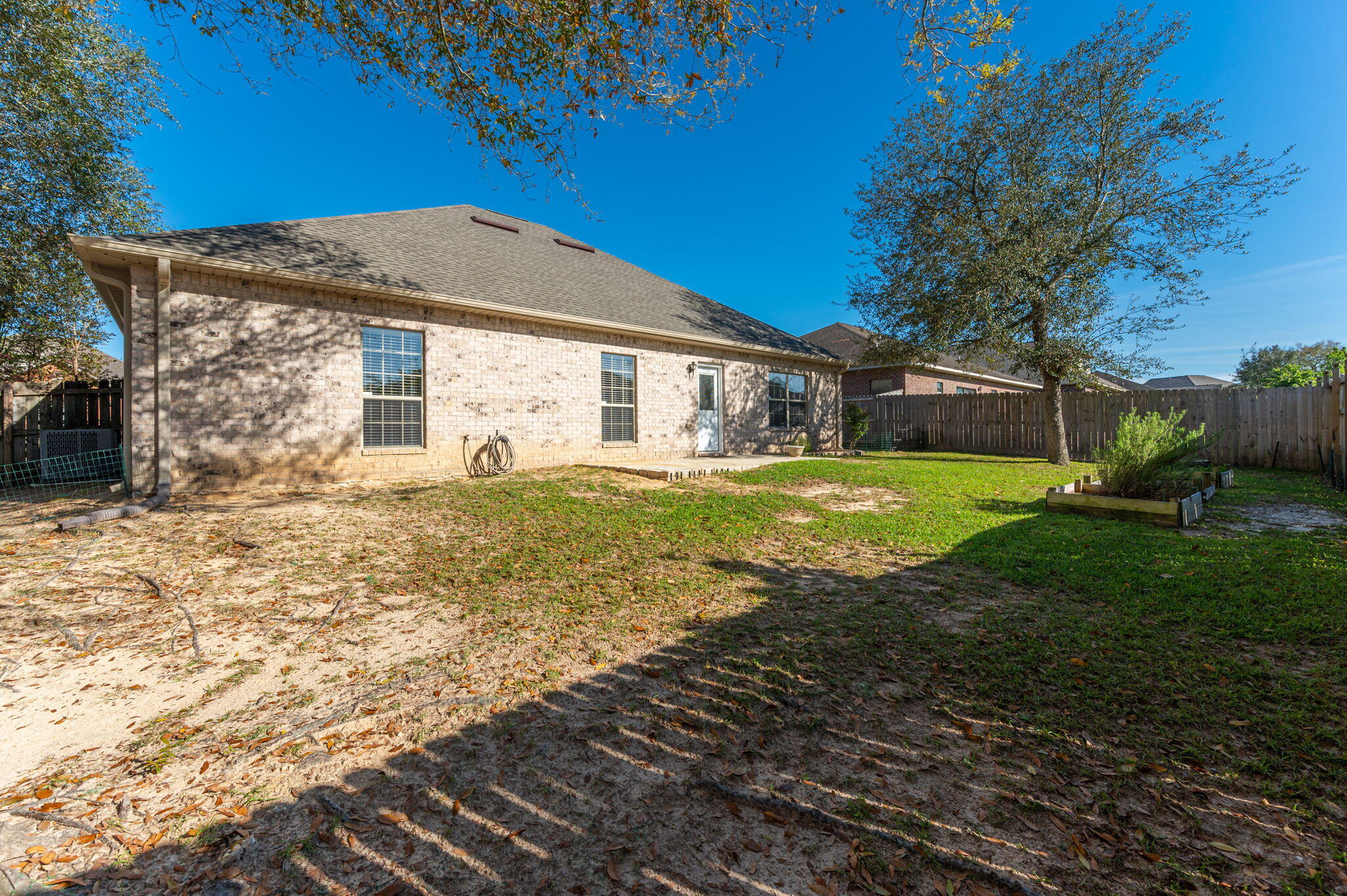 4623 Hermosa Road Crestview, FL 32539 - Photo 36 of 41 a view of a house with backyard and sitting area