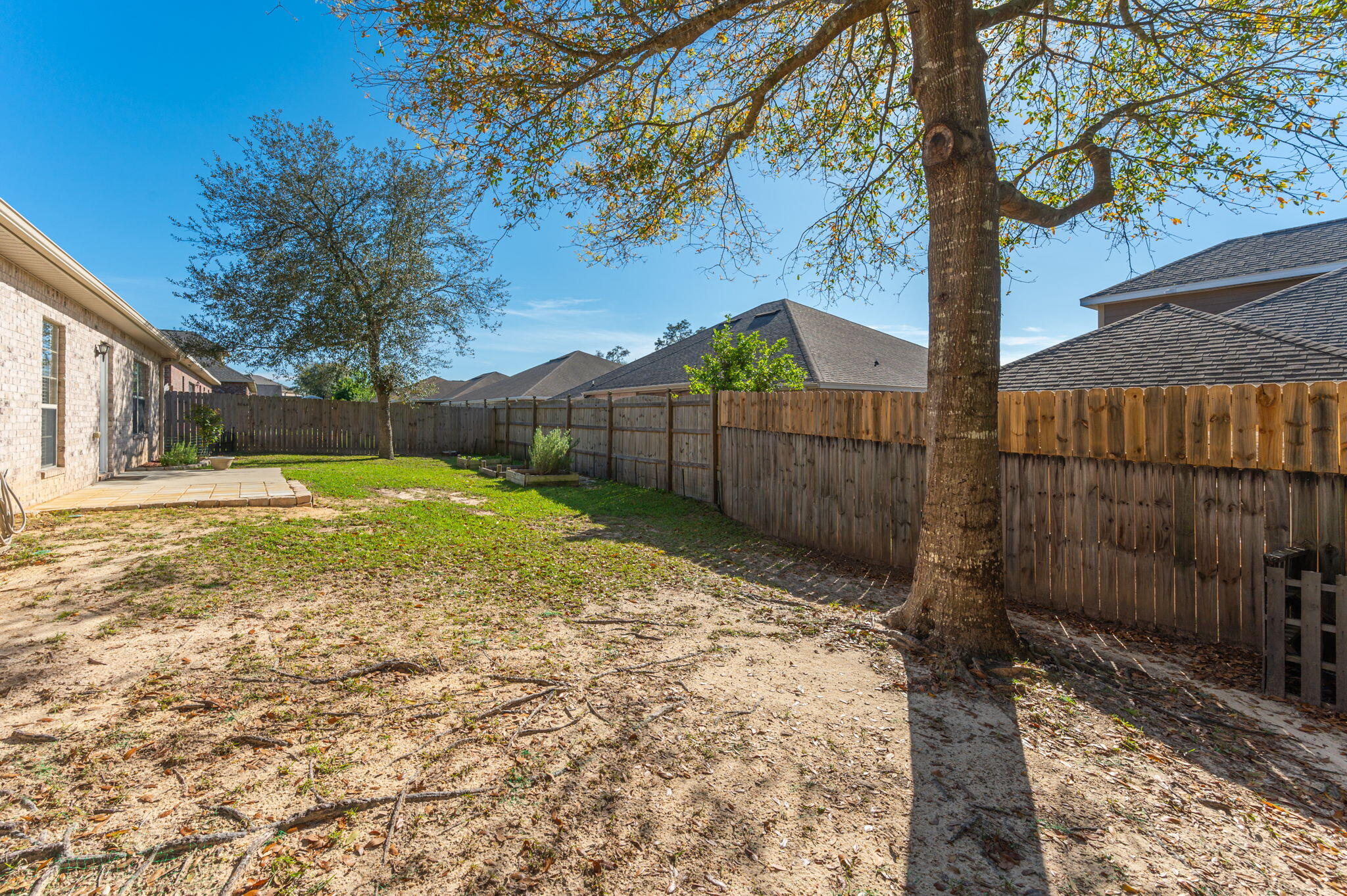4623 Hermosa Road Crestview, FL 32539 - Photo 37 of 41 a view of a backyard with a tree