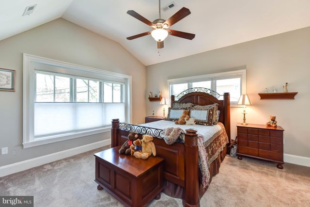 a bed room with furniture and a window