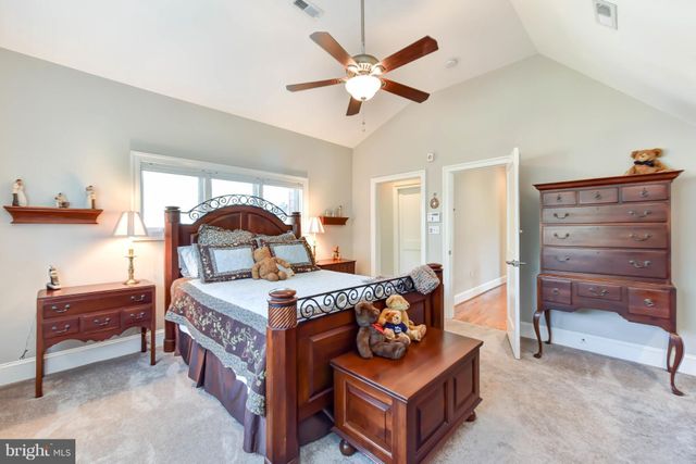 a bedroom with a bed and furniture