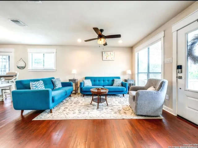 a living room with furniture and a large window