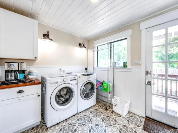 a utility room with dryer and washer