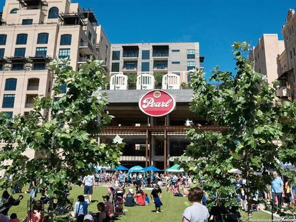 a view of a two chairs and table in a patio