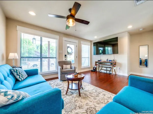 a living room with furniture and a large window