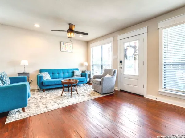 a living room with furniture and a window