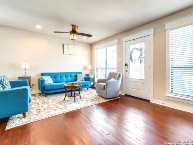 a living room with furniture and a window