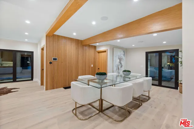 a living room with furniture a dining table and chairs