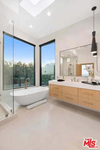 a bathroom with a tub and sink