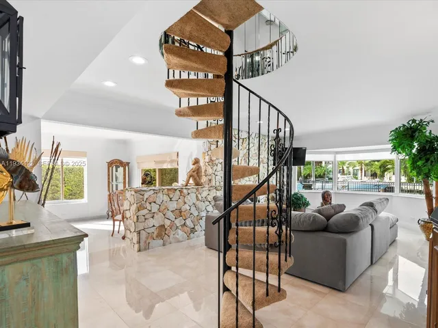 a livingroom with furniture staircase and a living room